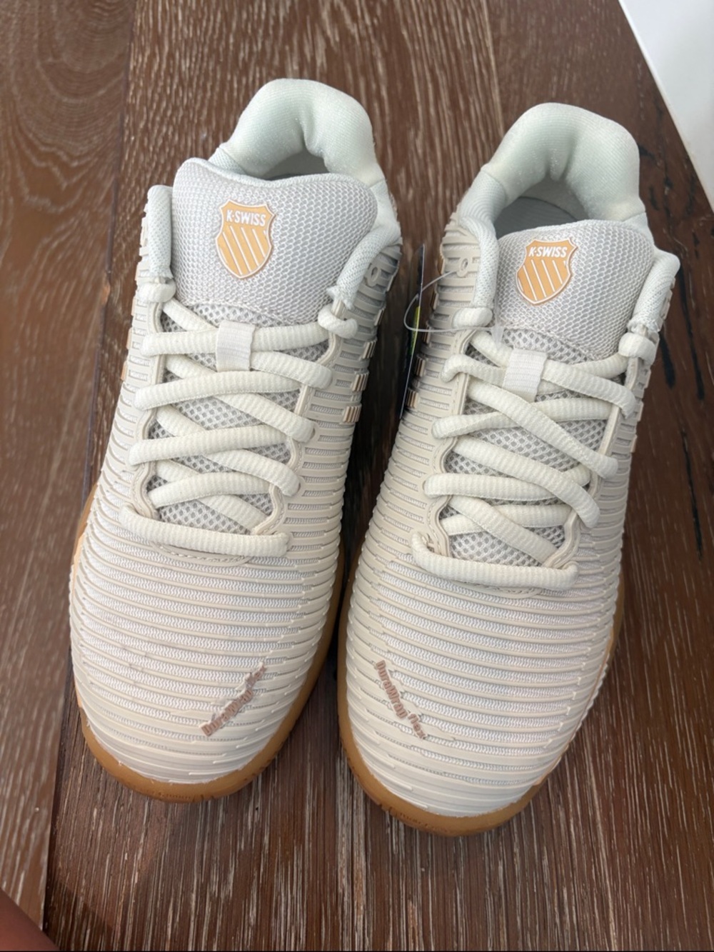 K-Swiss Off-White/Tan Athletic Sneaker with Yellow Shield Logo
